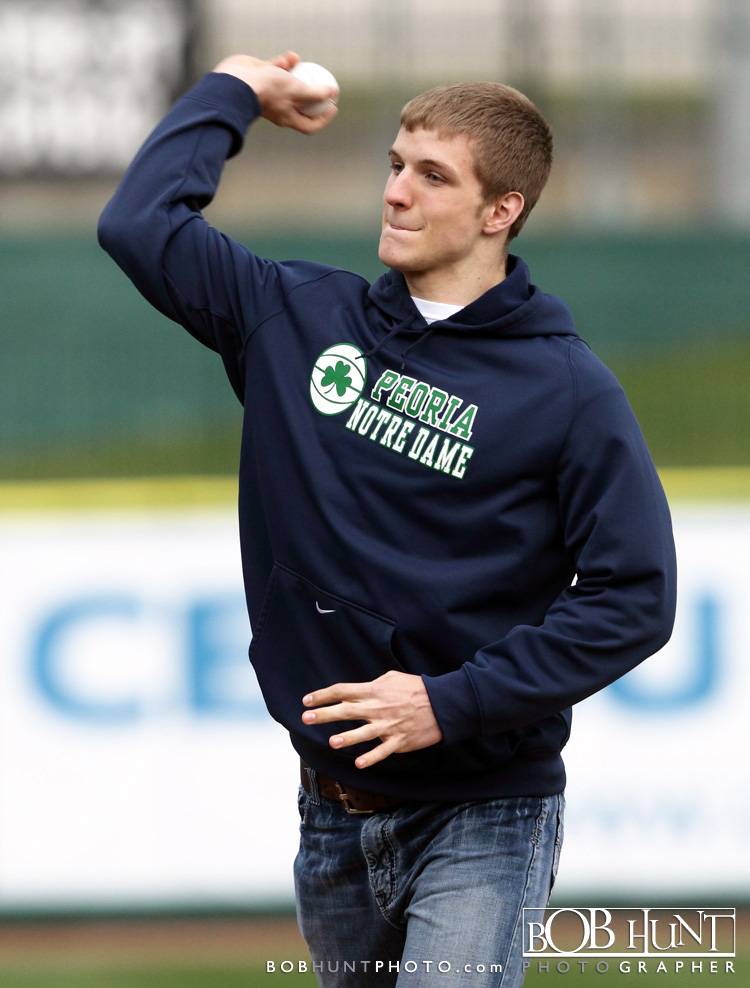 Peoria Notre Dame all-state basketball player and Michigan recruit Max Bielfeldt throws out the first pitch on opening night at the Peoria Chiefs game