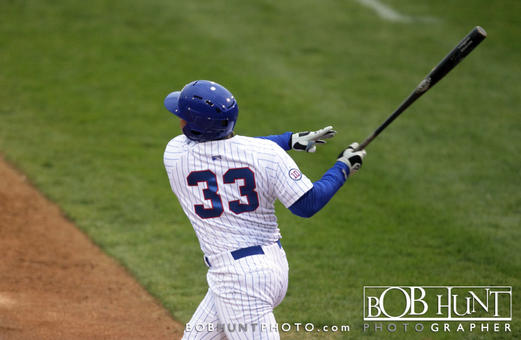 Peoria Chiefs 1st baseman Richard Jones drills a single against Cedar Rapids