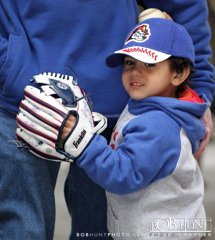 A young baseball fan gets awaits the start of the game between the Cedar Rapids Kernels and the Peoria Chiefs