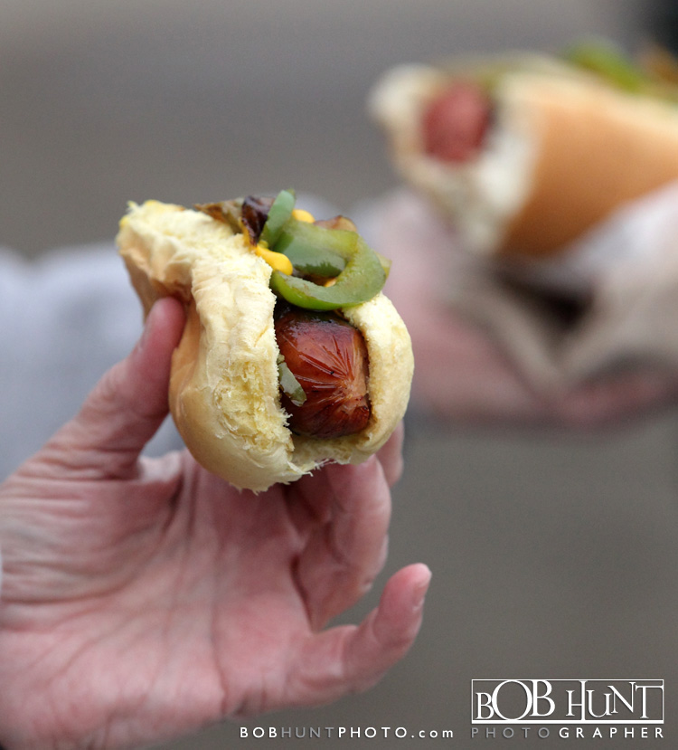 Fans enjoy a Bratwurst on opening night at O'Brien Field at the Peoria Chiefs home opener