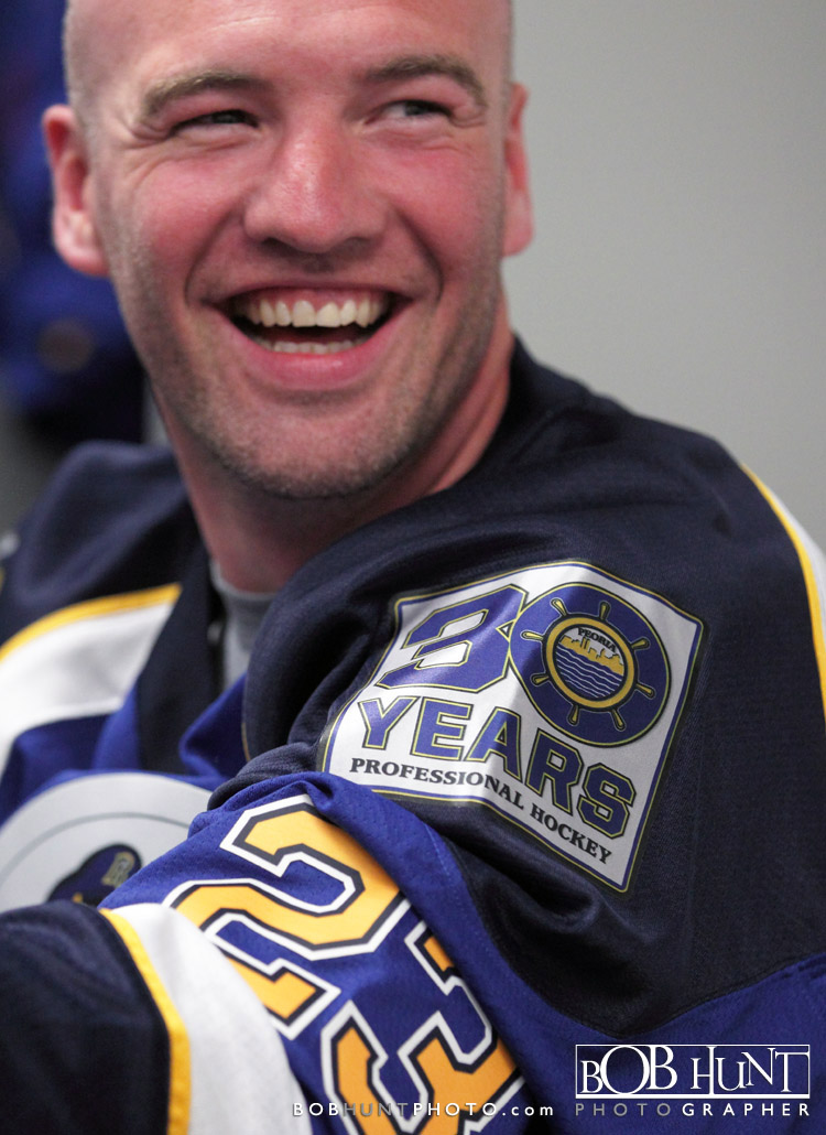 Peoria Rivermen alumni Tyler Rennette enjoys some stories in the locker room before the alumni game in Peoria, IL